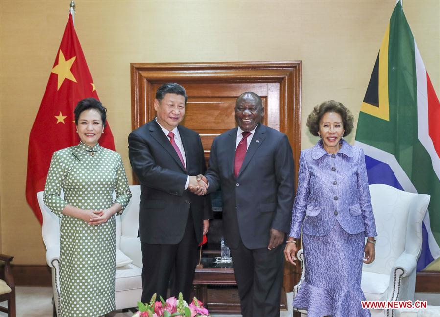 Chinese President Xi Jinping (2nd L) and his wife Peng Liyuan (1st L) pose for photos with South African President Cyril Ramaphosa (2nd R) and his wife Tshepo Motsepe ahead of the two leaders\' talks in Pretoria, South Africa, July 24, 2018. (Xinhua/Xie Huanchi)