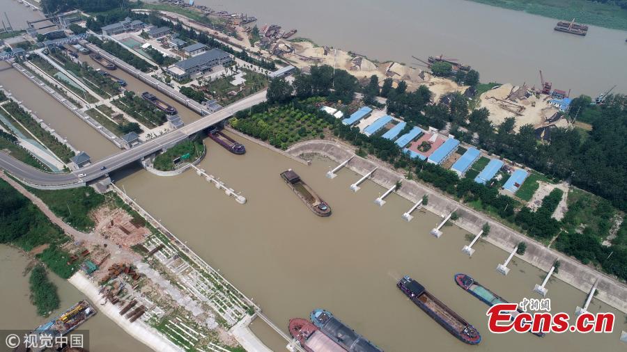 An aerial view of ships waiting to pass a navigation lock in Hongze Lake, Huaian City, East China’s Jiangsu Province, July 25, 2018. Thousands of ships had to berthed in port for days due to tropical storm Ampil. (Photo/VCG)