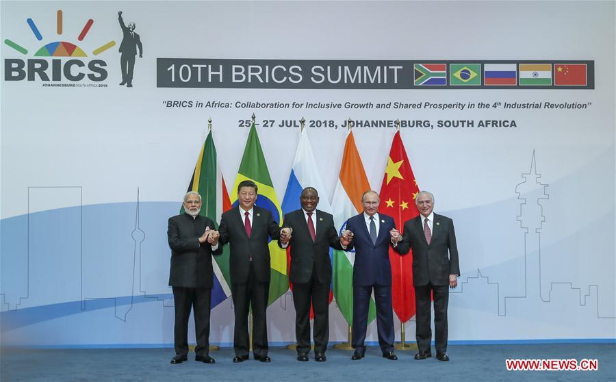 Chinese President Xi Jinping (2nd L), Brazilian President Michel Temer (1st R), Russian President Vladimir Putin (2nd R), Indian Prime Minister Narendra Modi (1st L) and South African President Cyril Ramaphosa pose for a group photo during the Plenary Session of the 10th BRICS summit in Johannesburg, South Africa, July 26, 2018. (Xinhua/Xie Huanchi)