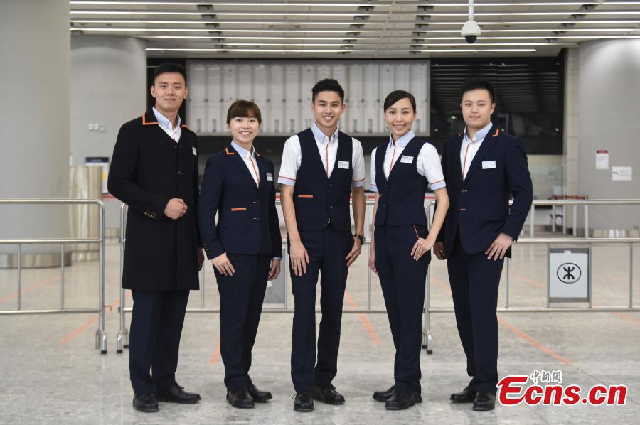 Photo taken on July 26, 2018 shows staff members in their new uniforms at the West Kowloon Station of the Guangzhou-Shenzhen-Hong Kong Express Rail Link that will open in September. The Hong Kong section of the Express Rail Link runs from the station in West Kowloon north to the Shenzhen-Hong Kong border, where it connects with the mainland section. (Photo: China News Service/Sheung Man Mak)