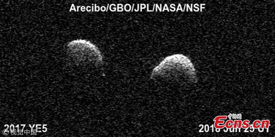 Bi-static radar images of the binary asteroid 2017 YE5 from the Arecibo Observatory and the Green Bank Observatory on June 25. (Photo/VCG)

The near-Earth asteroid 2017 YE5 was first spotted by astronomers on December 2017 but little was known about the space rock. One year later and on June 21, 2018, the asteroid made its closest approach to the planet for the next 170 years. When the asteroid approached within 3.7 million miles of Earth, NASA was to reveal some of its incredible physical proprieties. NASA’s astronomers at the Goldstone Sola System Radar (GSSR) in California determined YE5 was not one, but two asteroids ? a so-called binary system.GSSR observations revealed two very distinct shapes dancing around one another in space. NASA’s new photographs of the binary system offer the most detailed observations yet of this unusual phenomenon.