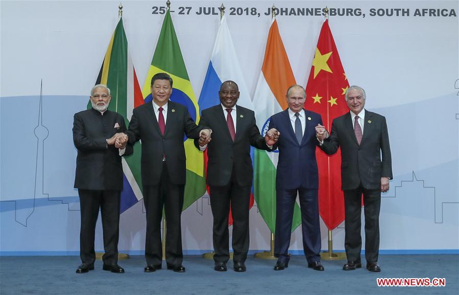 Chinese President Xi Jinping (2nd L), Brazilian President Michel Temer (1st R), Russian President Vladimir Putin (2nd R), Indian Prime Minister Narendra Modi (1st L) and South African President Cyril Ramaphosa pose for a group photo during the Plenary Session of the 10th BRICS summit in Johannesburg, South Africa, July 26, 2018. (Xinhua/Xie Huanchi)