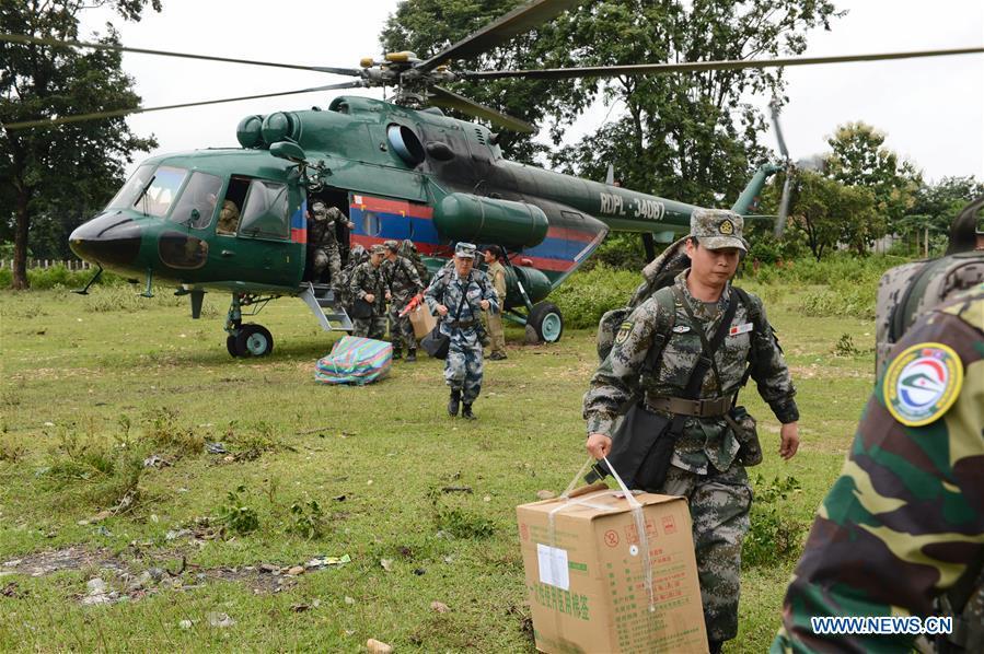 A Chinese People\'s Liberation Army (PLA) medical team arrive at the flooded-area in Attapeu, Laos, July 26, 2018. A medical contingent from the Chinese People\'s Liberation Army (PLA), which is on the \