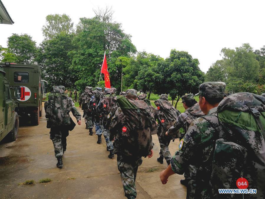 A Chinese People\'s Liberation Army (PLA) medical team leaves the Lao capital of Vientiane for Attapeu, Laos, July 25, 2018. A medical contingent from the Chinese People\'s Liberation Army (PLA), which is on the \