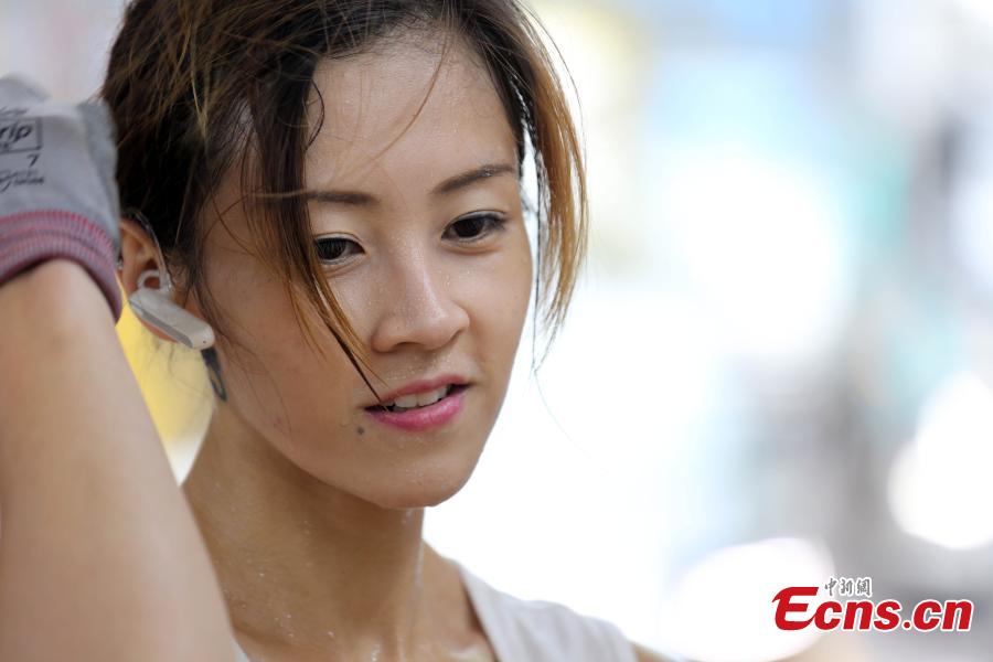 Zhu works in Ng Fong Street in San Po Kong, Hong Kong. Zhu became an internet sensation last year when photos of her working as a porter were shared online. Zhu, 30, transports goods for a local grocery store. (Photo: China News Service/Hong Shaokui)