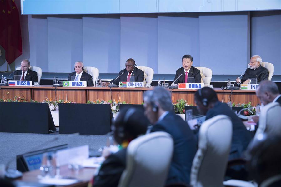 Chinese President Xi Jinping makes a speech to an outreach dialogue grouping leaders from the BRICS, the \