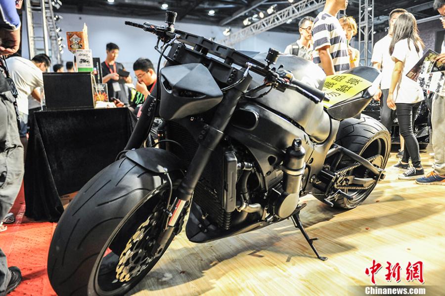 Photo taken on July 28- 29, 2018 shows a motorcycle exhibition held at the China National Convention Center in Beijing. Organized by an online auto platform, the fair displayed hundreds of motorcycles from home and abroad, such as the Ducati 959 sport bike, vintage Changjiang 650 sidecar, the Harley-Davidson WLA produced to the U.S. Army during the World War II and Benelli Leoncino bike. (Photo: China News Service/Fu Yu)
