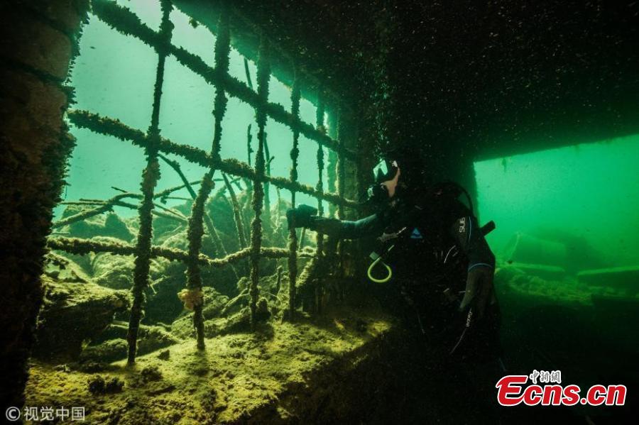 A diver explores Estonia’s Rummu Prison, situated in the middle of a submerged quarry. When Estonia regained its independence in 1991, the Soviets moved out and the labor prison at Rummu was closed. This once eerie place to hold inmates is now an amazingly popular beach where people swim in the deep blue water and dive. (Photo/VCG)