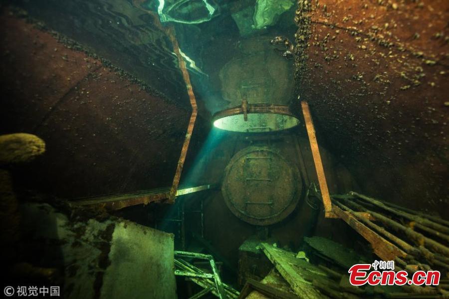 A diver explores Estonia’s Rummu Prison, situated in the middle of a submerged quarry. When Estonia regained its independence in 1991, the Soviets moved out and the labor prison at Rummu was closed. This once eerie place to hold inmates is now an amazingly popular beach where people swim in the deep blue water and dive. (Photo/VCG)