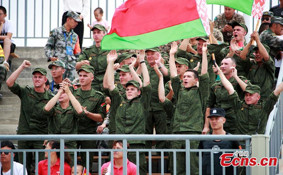 Public spectators and soldiers watch the \