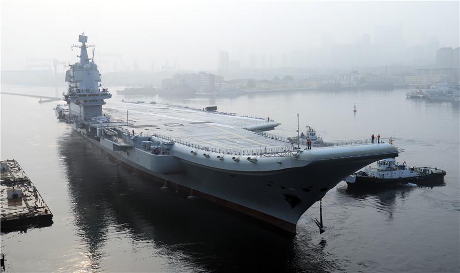 China\'s first domestically designed aircraft carrier set sail on its maiden sea trial on May 13, 2018. (Photo by Li Gang)
The ship, the largest and most sophisticated naval vessel in China, was designed and built by the nation on its own. Currently, the Navy operates a sole aircraft carrier, CNS Liaoning, which was originally a Soviet-era vessel that was extensively refitted at the Dalian shipbuilder.
