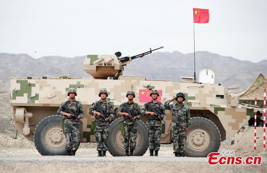 Chinese soldiers pose for a photo during the “Clear Sky” contest at the International Army Games 2018 in Korla in Xinjiang Uygur Autonomous Region, July 31, 2018. China beat six other teams to win the contest. Three of the tournament events - \