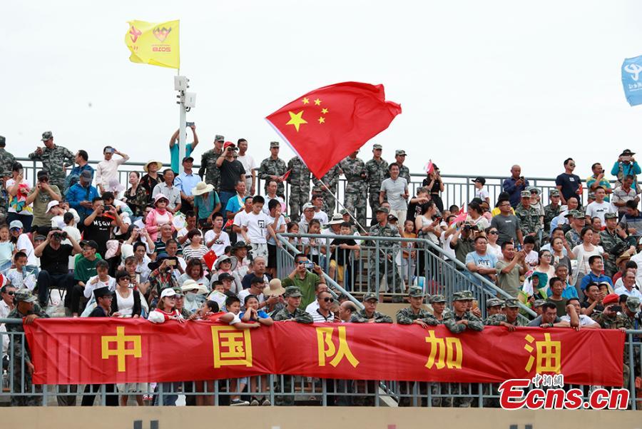 Public spectators and soldiers watch the \