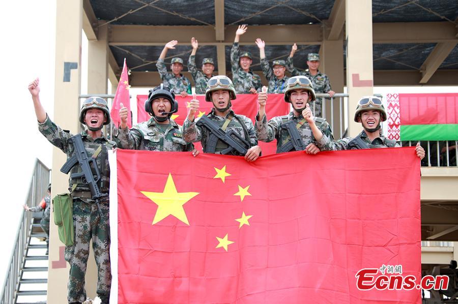 Chinese soldiers pose for a photo during the “Clear Sky” contest at the International Army Games 2018 in Korla in Xinjiang Uygur Autonomous Region, July 31, 2018. China beat six other teams to win the contest. Three of the tournament events - \