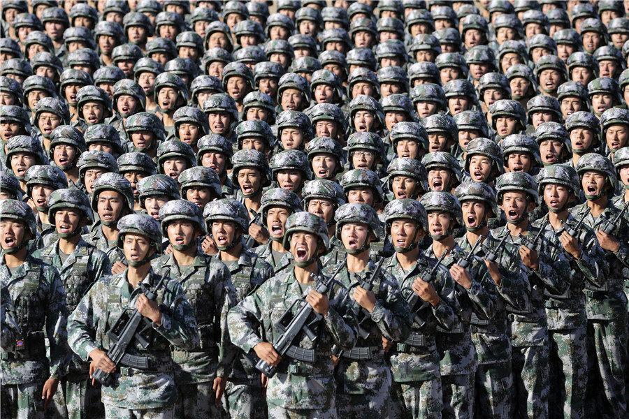 Troops train for a military parade at Zhurihe training base in North China\'s Inner Mongolia autonomous region, July 30, 2017. The parade was held to celebrate the 90th anniversary of the founding of the Chinese People\'s Liberation Army. (Photo by Feng Yongbin/China Daily)