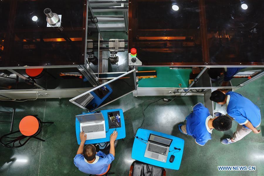 Staff members work at the Guizhou Space Appliance Co. Ltd in Guiyang, capital of southwest China\'s Guizhou Province, Aug. 1, 2018. Guizhou has become a pioneer in China\'s big data development. Big data is being widely applied in government management, business and daily life, contributing over 20 percent to the economic growth of Guizhou Province. The number of big data-related companies in Guizhou Province has grown from less than 1,000 in 2013 to more than 8,500 in 2018.(Xinhua/Li Mangmang)