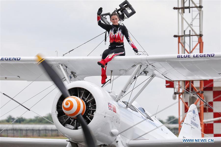 Performer of an aerobatic team waves after performance during Huangguoshu Waterfalls Flight Conference in Anshun, southwest China\'s Guizhou Province, Aug. 3, 2018. (Xinhua/Liu Xu)