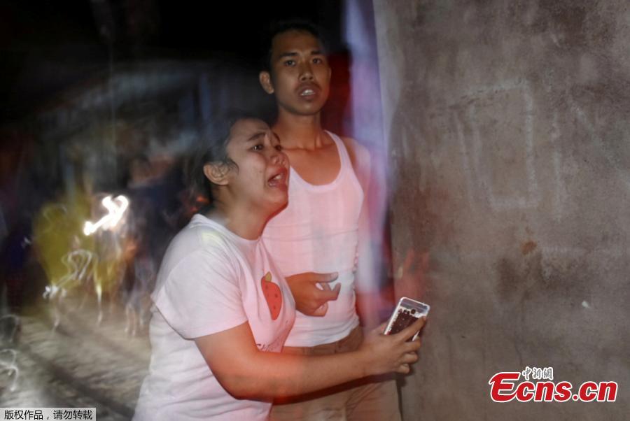 People react following an earthquake in Ampenan district, Mataram, Lombok, Indonesia August 5, 2018, in this photo taken by Antara Foto. (Photo/Agencies)
