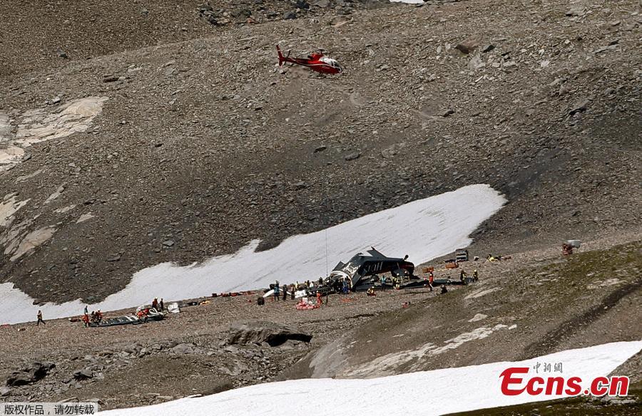 Accident investigators and rescue personnel work at the wreckage of a Junkers JU52 aircraft in Flims on August 5, 2018, after it crashed into Piz Segnas, a peak in eastern Switzerland on August 4. Twenty people are confirmed dead after a vintage World War II aircraft crashed into a Swiss mountainside, police reports said. The Junker JU52 HB-HOT aircraft, built in Germany in 1939 and now a collector’s item, belongs to JU-Air, a company with links to the Swiss air force, the ATS news agency reported. (Photo/VCG)