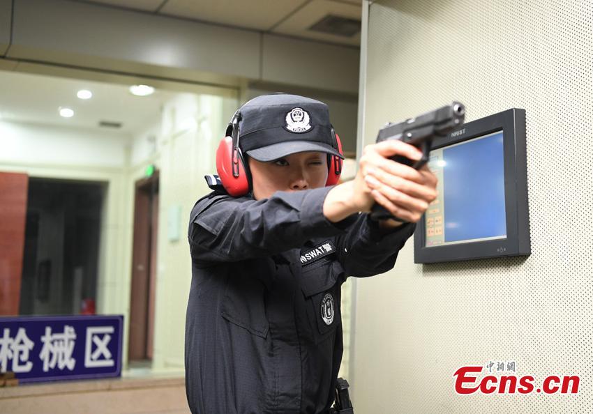 Li Meixuan, a special police officer with the Changchun Railway Public Security Bureau, takes part in shooting training in Changchun City, Jilin Province. The 33-year-old puts high expectations on herself in training. Her team is predominantly responsible for emergency responses to terror attacks. She said she chooses to be a policewoman because of the influence of her father, also a police officer. (Photo: China News Service/Zhang Yao)