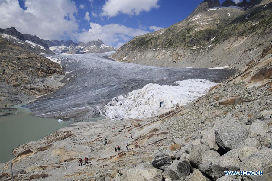 Photo taken on Aug. 5, 2018 shows the Rhone Glacier covered with white blankets near the Furka Pass in Switzerland. The Rhone Glacier is protected by special white blankets to prevent it from further melting as a result of global warming. (Xinhua/Xu Jinquan)