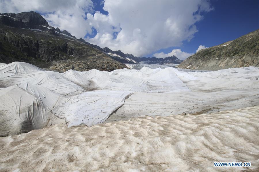 Photo taken on Aug. 5, 2018 shows the Rhone Glacier covered with white blankets near the Furka Pass in Switzerland. The Rhone Glacier is protected by special white blankets to prevent it from further melting as a result of global warming. (Xinhua/Xu Jinquan)