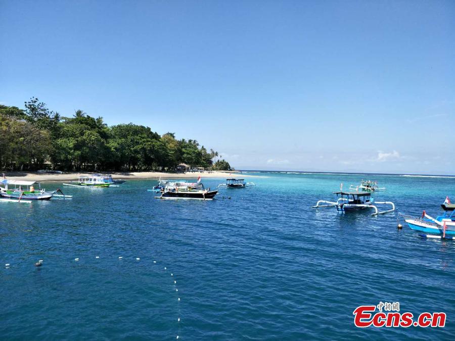 Photo taken on Aug. 7 shows empty boats on the water of the Lombok Island, Indonesia after a 7.0-magnitude earthquake hit the island on Aug. 5, 2018. (Photo: China News Service/Lin Yongchuan)