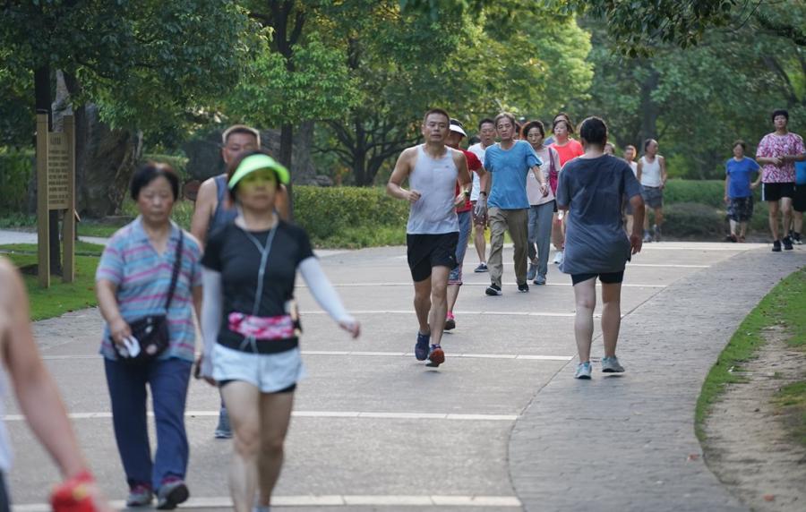 People jog at the park on August 8.