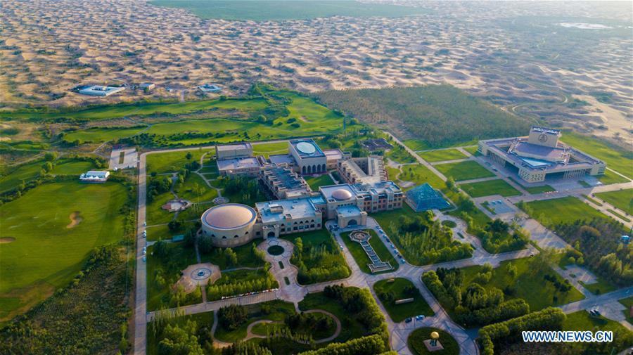 Aerial photo taken on July 11, 2018 shows Qixinghu tourist area at the Kubuqi Desert, north China\'s Inner Mongolia Autonomous Region. Kubuqi, the seventh largest desert in China, is a good example of China\'s success in alleviating desertification. About 6,460 square kilometers of the Kubuqi desert has been reclaimed in the last 30 years. (Xinhua/Peng Yuan)