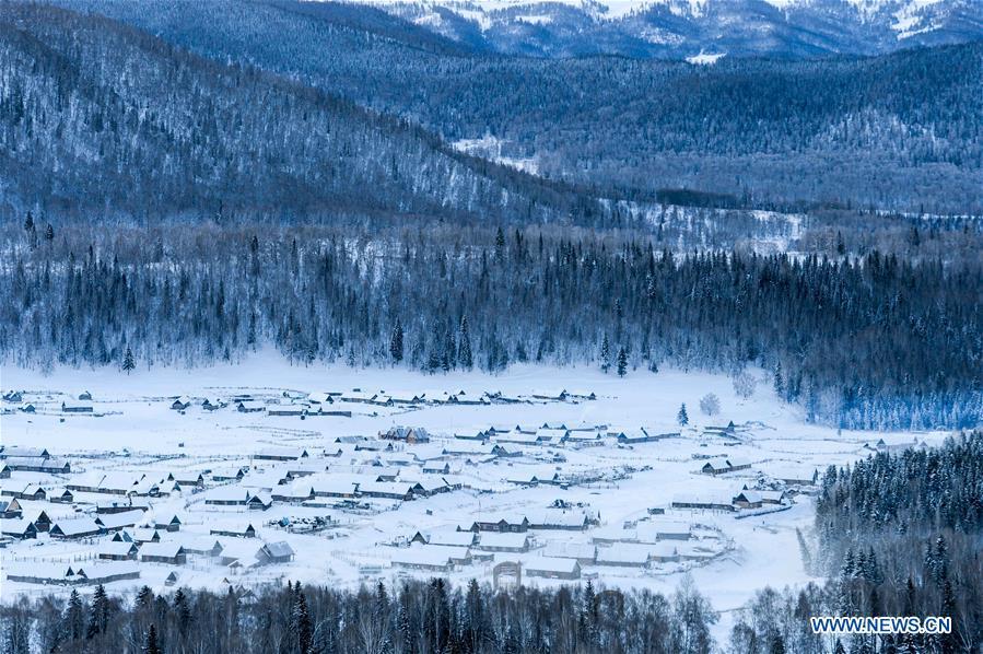 Photo taken on Jan. 2, 2018 shows a view of snowed-covered Hemu Village in the Kanas scenic area, northwest China\'s Xinjiang Uygur Autonomous Region. China\'s westernmost Xinjiang Uygur Autonomous Region welcomed a record high of 107 million tourists in 2017, up 32.4 percent year on year. In addition, tourists spent over 182 billion yuan (28.4 billion U.S. dollars) in Xinjiang last year, 30 percent more than in 2016.