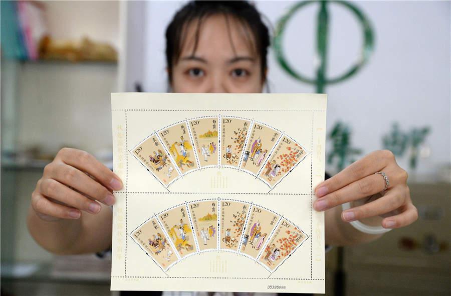 A staff member from the Handan branch of China Post shows the newly issued stamps featuring six solar terms in the autumn. (Photo/Asianewsphoto)

China Post issued a set of special stamps featuring the traditional Chinese solar terms on Aug. 7, which marks the Start of Autumn. The stamp set consists of six stamps that represent six different solar terms in the autumn: Start of Autumn, End of Heat, White Dew, Autumn Equinox, Cold Dew and Frost\'s Descent.

The price for a whole set is 7.2 yuan (around $1.1) and each stamp has a nominal value of 1.2 yuan. The issued stamps portray people and autumn scenes in detail, and highlight the sense of accomplishment and satisfaction in life and labor during the harvest season.