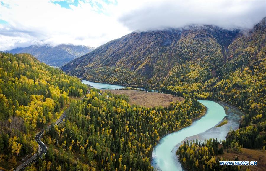 Aerial photo shows a view of the moon bay in the Kanas scenic area in northwest China\'s Xinjiang Uygur Autonomous Region, Sept. 22, 2017. China\'s westernmost Xinjiang Uygur Autonomous Region welcomed a record high of 107 million tourists in 2017, up 32.4 percent year on year. In addition, tourists spent over 182 billion yuan (28.4 billion U.S. dollars) in Xinjiang last year, 30 percent more than in 2016. (Xinhua/Zhao Ge)