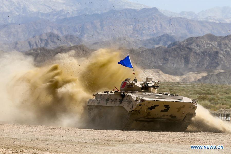 An armored vehicle operated by a Chinese crew drives during a match of the International Army Games 2018 in Korla, northwest China\'s Xinjiang Uygur Autonomous Region, Aug. 5, 2018. Three contests of the International Army Games 2018 in northwest China\'s Xinjiang Uygur Autonomous Region ended here Wednesday. (Xinhua/Wang Pengfei)