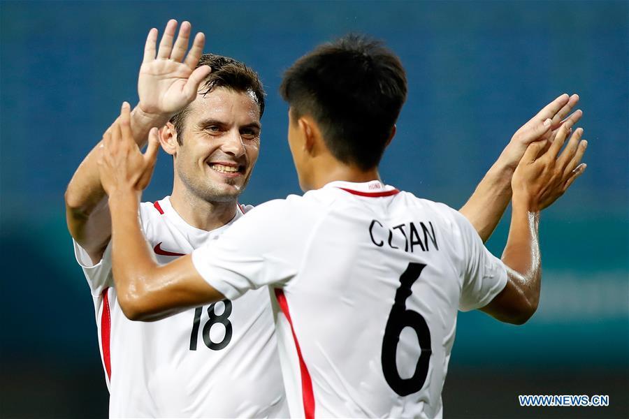 Tan Chun Lok (R) of Hong Kong of China celebrates with his teammate Jorge Tarres Paramo after scoring during the Men\'s Football Group A match between Hong Kong of China and Laos at the 18th Asian Games at Patriot Stadium in Bekasi, Indonesia, Aug. 10, 2018. Hong Kong of China won 3-1. (Xinhua/Wang Lili)