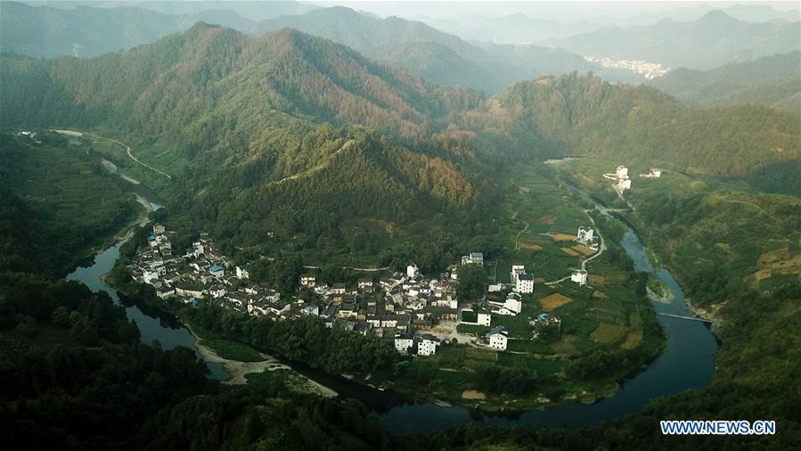Aerial photo taken on Aug. 10, 2018 shows scenery at dawn in Shitan Village, Shexian County, east China\'s Anhui Province. (Xinhua/Zhang Duan)