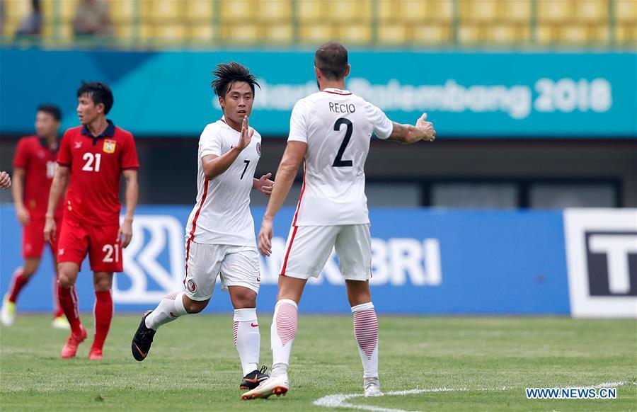 Cheng Chin Lung (2nd R) of Hong Kong of China celebrates scoring during the Men\'s Football Group A match between Hong Kong of China and Laos at the 18th Asian Games at Patriot Stadium in Bekasi, Indonesia, Aug. 10, 2018. Hong Kong of China won 3-1. (Xinhua/Wang Lili)