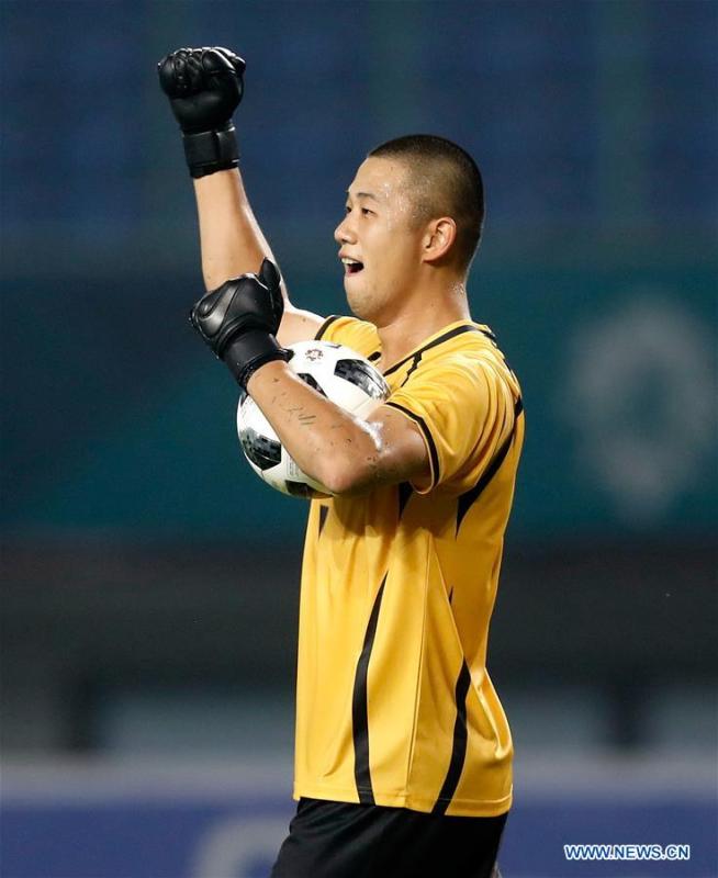 Pan Wenchieh, goalkeeper of Chinese Taipei reacts after the Men\'s Football Group A match between Chinese Taipei and Palestine at the 18th Asian Games at Patriot Stadium in Bekasi, Indonesia, Aug. 10, 2018. The match ended with a 0-0 draw. (Xinhua/Wang Lili)