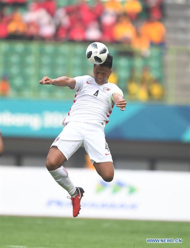 Lau Hok Ming of Hong Kong of China competes during the Men\'s Football Group A match between Hong Kong of China and Laos at the 18th Asian Games at Patriot Stadium in Bekasi, Indonesia, Aug. 10, 2018. (Xinhua/Jia Yuchen)