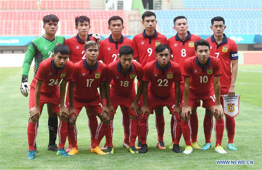 Players of Laos pose for a team photo before the Men\'s Football Group A match between Hong Kong of China and Laos at the 18th Asian Games at Patriot Stadium in Bekasi, Indonesia, Aug. 10, 2018. (Xinhua/Jia Yuchen)