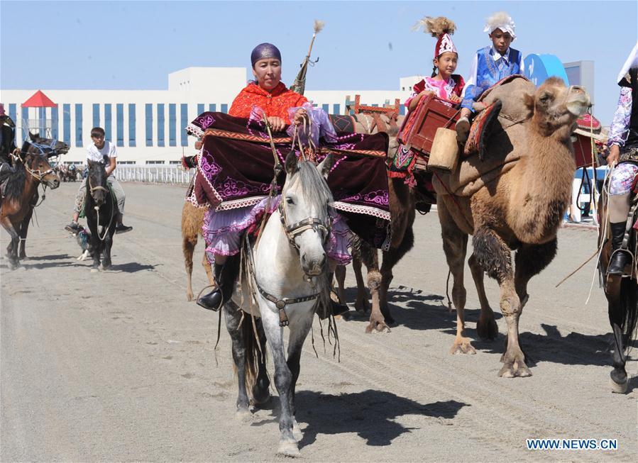 Horses and camels perform during the opening ceremony of a folk custom tourism festival held in the Kazak Autonomous County of Mori in northwest China\'s Xinjiang Uygur Autonomous Region, Aug. 11, 2018. The two-day festival opened here on Saturday. (Xinhua/Sadat)