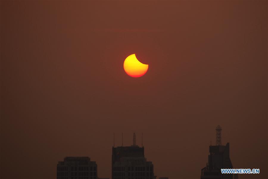 Photo taken on Aug. 11, 2018 shows the sun going through a partial solar eclipse in Jinan, capital of east China\'s Shandong Province. (Xinhua)