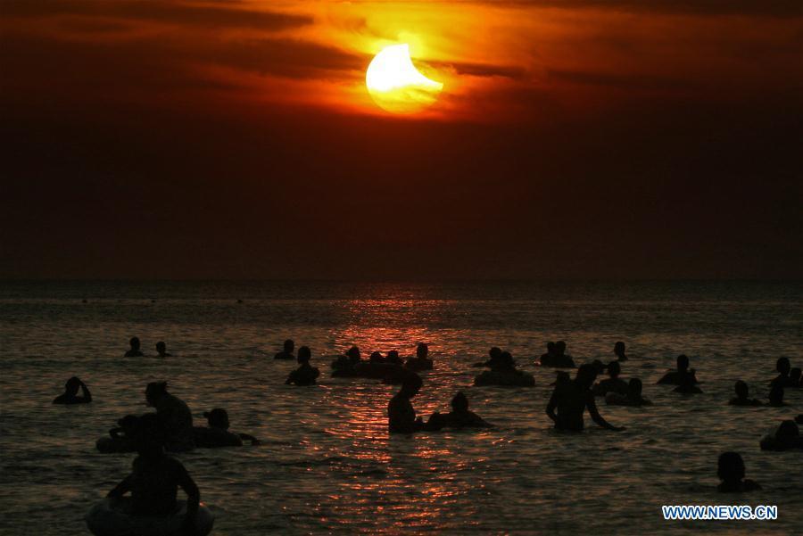 Photo taken on Aug. 11, 2018 shows the sun going through a partial solar eclipse in Yantai, east China\'s Shandong Province. (Xinhua/Tang Ke)
