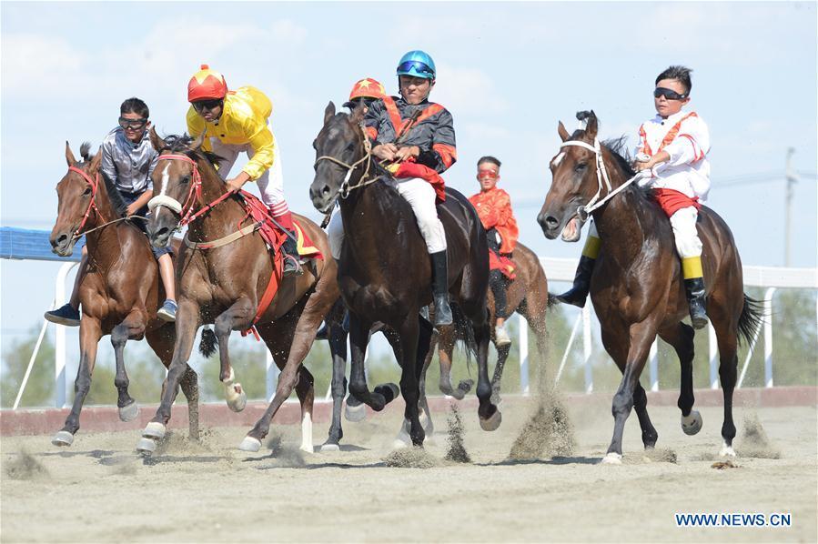 Contestants take part in a horse racing during a folk custom tourism festival held in the Kazak Autonomous County of Mori in northwest China\'s Xinjiang Uygur Autonomous Region, Aug. 11, 2018. The two-day festival opened here on Saturday. (Xinhua/Sadat)
