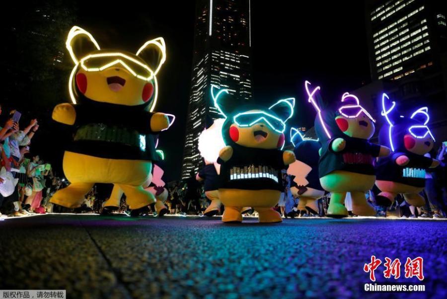 Performers wearing Pokemon\'s character Pikachu costumes take part in a night parade in Yokohama, Japan August 10, 2018. A total of over 1,500 Pikachus (in both frolicking and decorative forms) will be greeting visitors to Yokohama’s Minato Mirai harbor district. (Photo/Agencies)