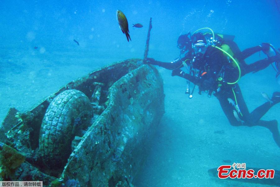 Divers explore the wreckage of an American bombardier fighter plane from the Second World War, the Lockheed P-38G Lightning, at 38 meters of depth, on August 12, 2018, off the coast of La Ciotat, southern France. (Photo/Agencies)