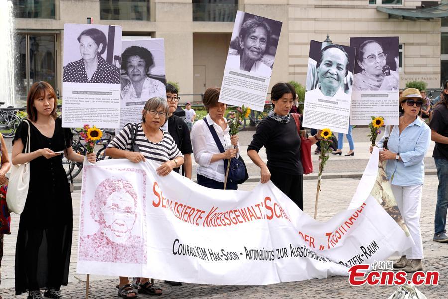 South Koreans and Japanese hold a rally to mark the International Memorial Day of Comfort Women in Berlin, Germany, Aug. 14, 2018. Protestors demanded the Japanese government apologize to victims and provide compensation for Japan’s system of wartime brothels. (Photo: China News Service/Peng Dawei)