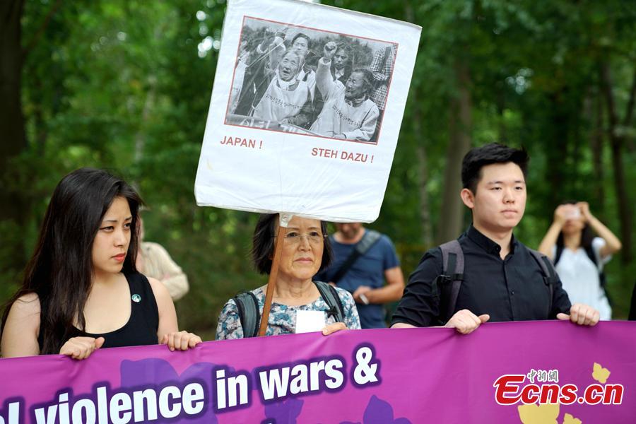 South Koreans and Japanese hold a rally to mark the International Memorial Day of Comfort Women in Berlin, Germany, Aug. 14, 2018. Protestors demanded the Japanese government apologize to victims and provide compensation for Japan’s system of wartime brothels. (Photo: China News Service/Peng Dawei)