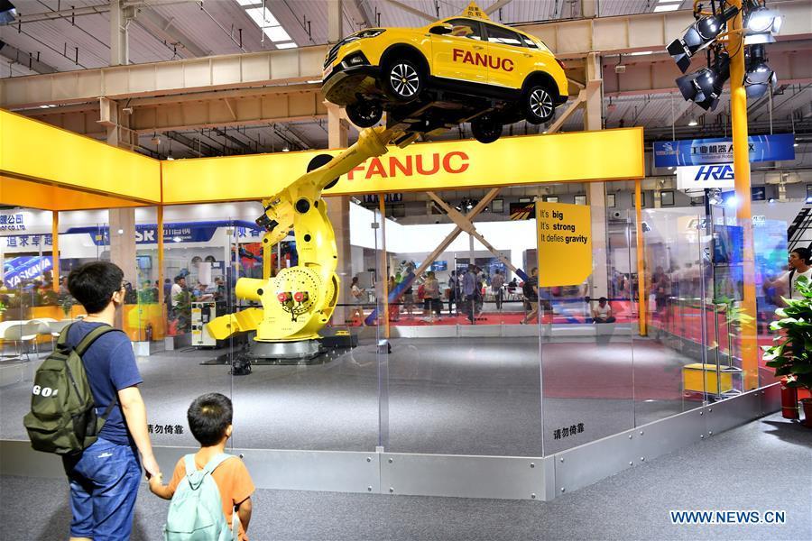 Photo taken on Aug. 15, 2018 shows an industrial robot at World Robot Conference 2018 in Beijing, capital of China. Kicking off on Wednesday, the conference attracted more than 160 domestic and international corporations exhibiting their cutting-edge products in the robotics industry. (Xinhua/Li Xin)