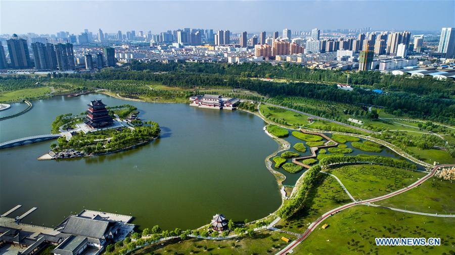 Aerial photo taken on Aug. 2, 2018 shows a view of the Yuxihe Park in the Yuyang District of Yulin City, northwest China\'s Shaanxi Province. The administrative region of Yulin City is located to the south of the Maowusu Desert. Environment protection measures have curbed the expansion of the desert and then witnessed the retreat of the desert as a result of the increase in planted forests and grasslands after reducing and stopping farming and animal husbandry. (Xinhua/Tao Ming)