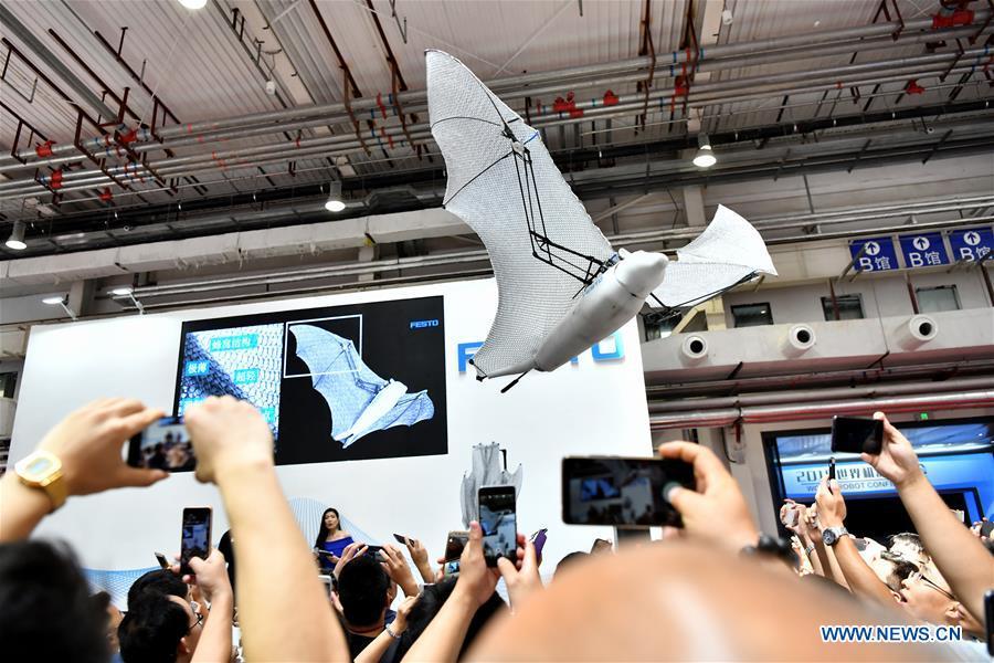 Photo taken on Aug. 15, 2018 shows a bionic FlyingFox robot at World Robot Conference 2018 in Beijing, capital of China. Kicking off on Wednesday, the conference attracted more than 160 domestic and international corporations exhibiting their cutting-edge products in the robotics industry. (Xinhua/Li Xin)